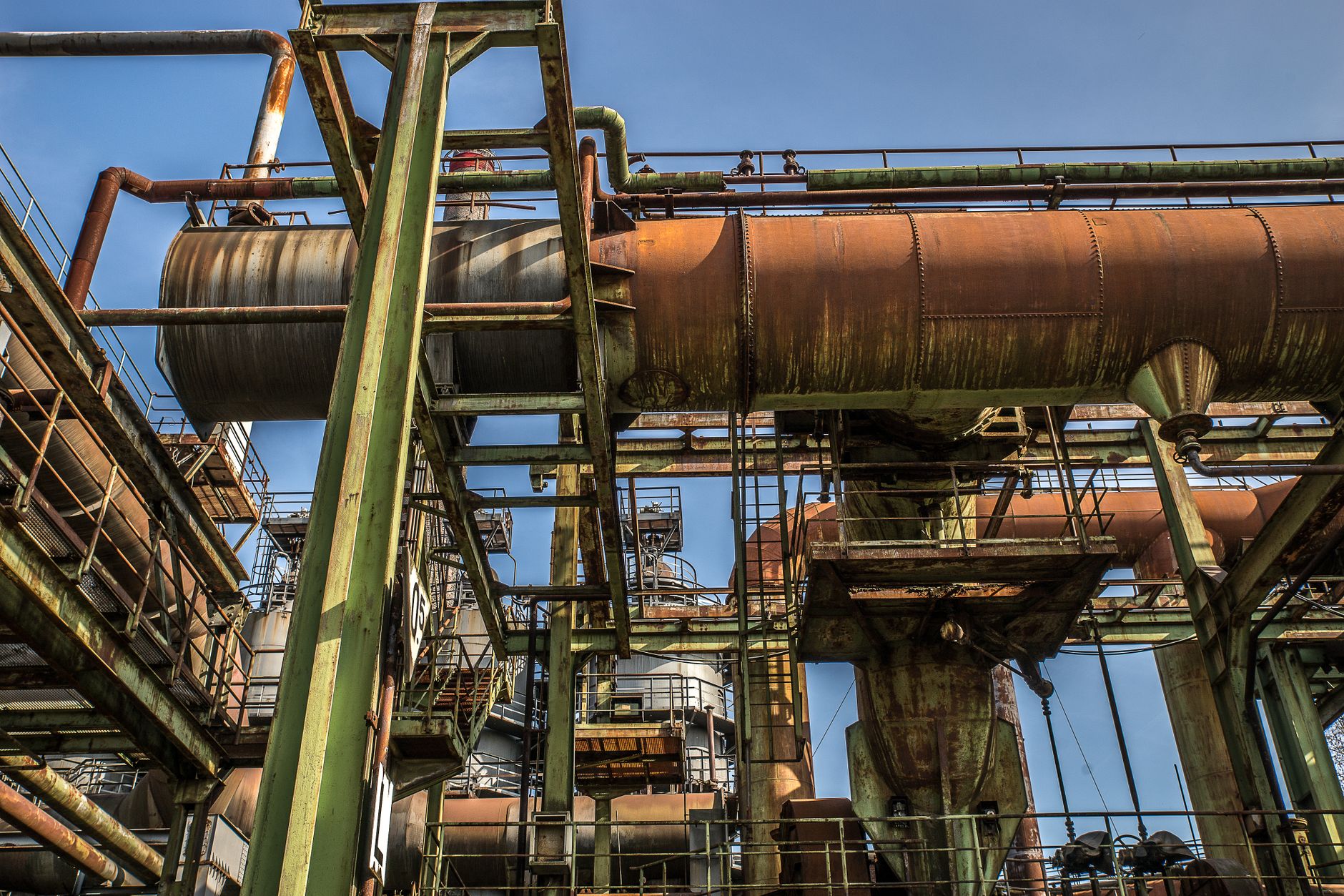 low angle view of an old industrial structure with pipes
